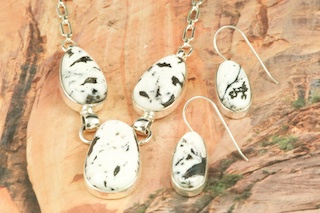 Genuine White Buffalo Turquoise set in Sterling Silver. This Beautiful Stone is formed from the minerals Calcite and Iron. It is mined near Tonopah Nevada. Stunning Necklace and Earrings Set. Created by Navajo Artist Tony Garcia. Signed by the artist.